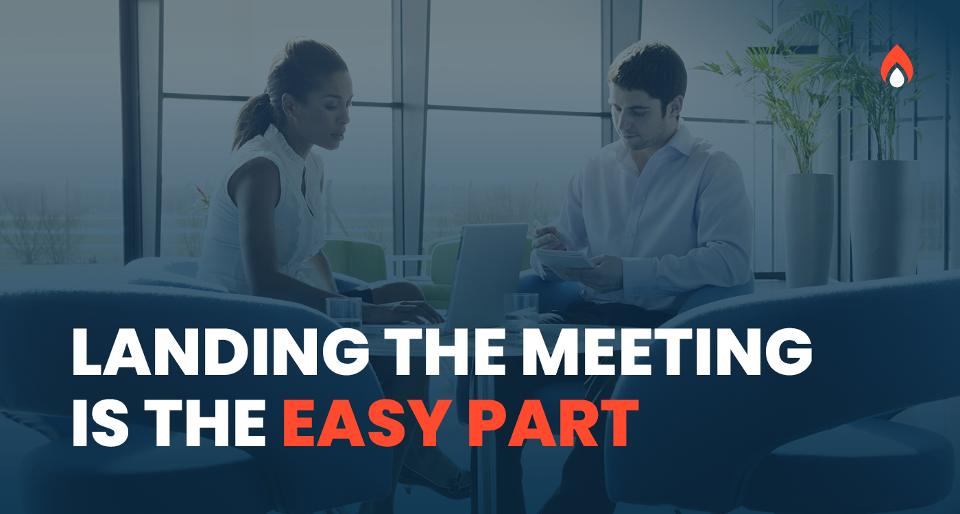 A sales professional and a prospective advertiser meeting face to face with a laptop open, representing how to lead a winning first meeting with prospective advertising clients.