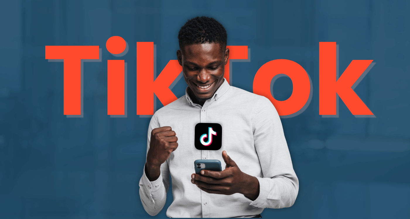 Person in a white shirt holding a phone with TikTok logo onscreen, against a blue background.
