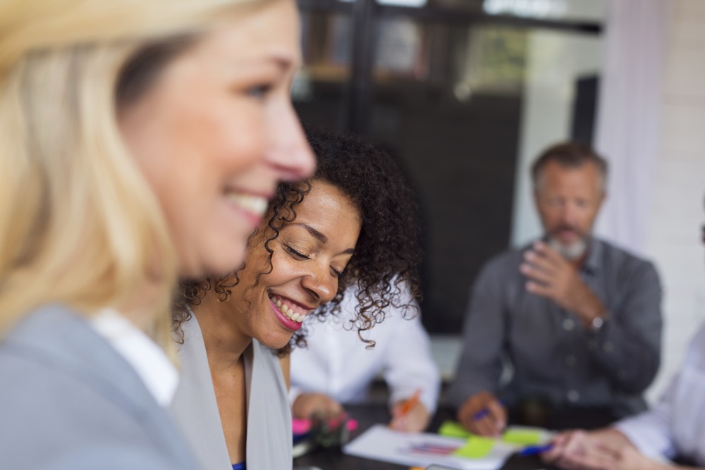 Business people laughing in office during meeting