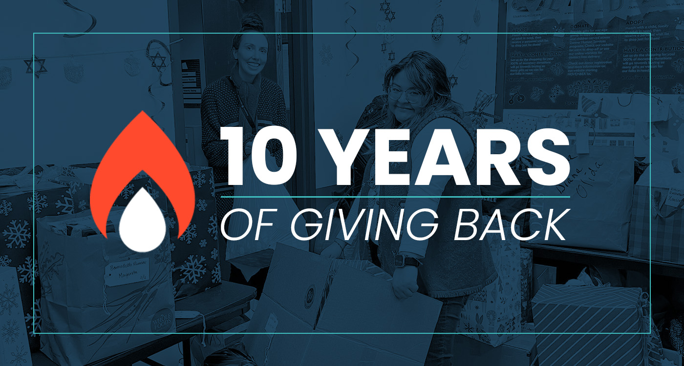 AdCellerant employees wrapping holiday gifts for families during the 10th annual Be a Giver Drive