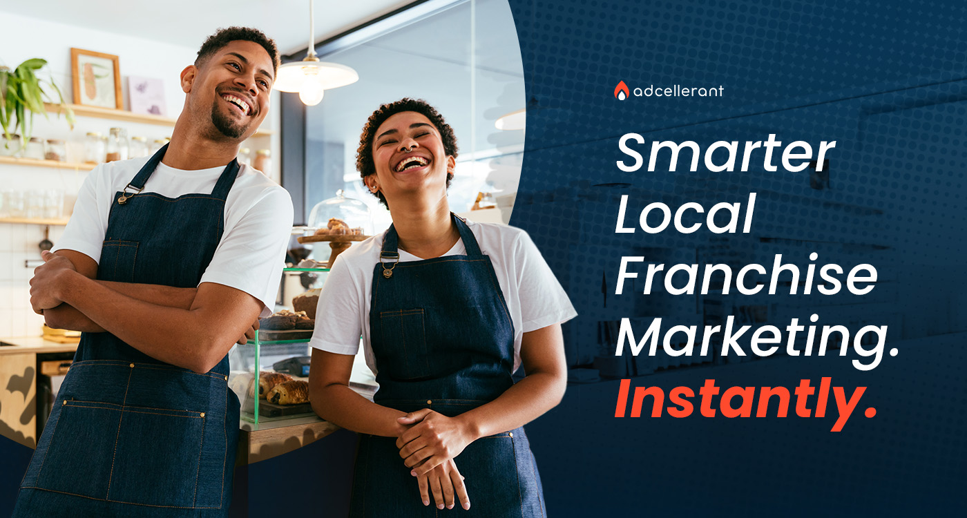 Two smiling franchise business owners in aprons standing confidently in their local shop, representing how AI-powered media planning helps franchise locations win in their local market.